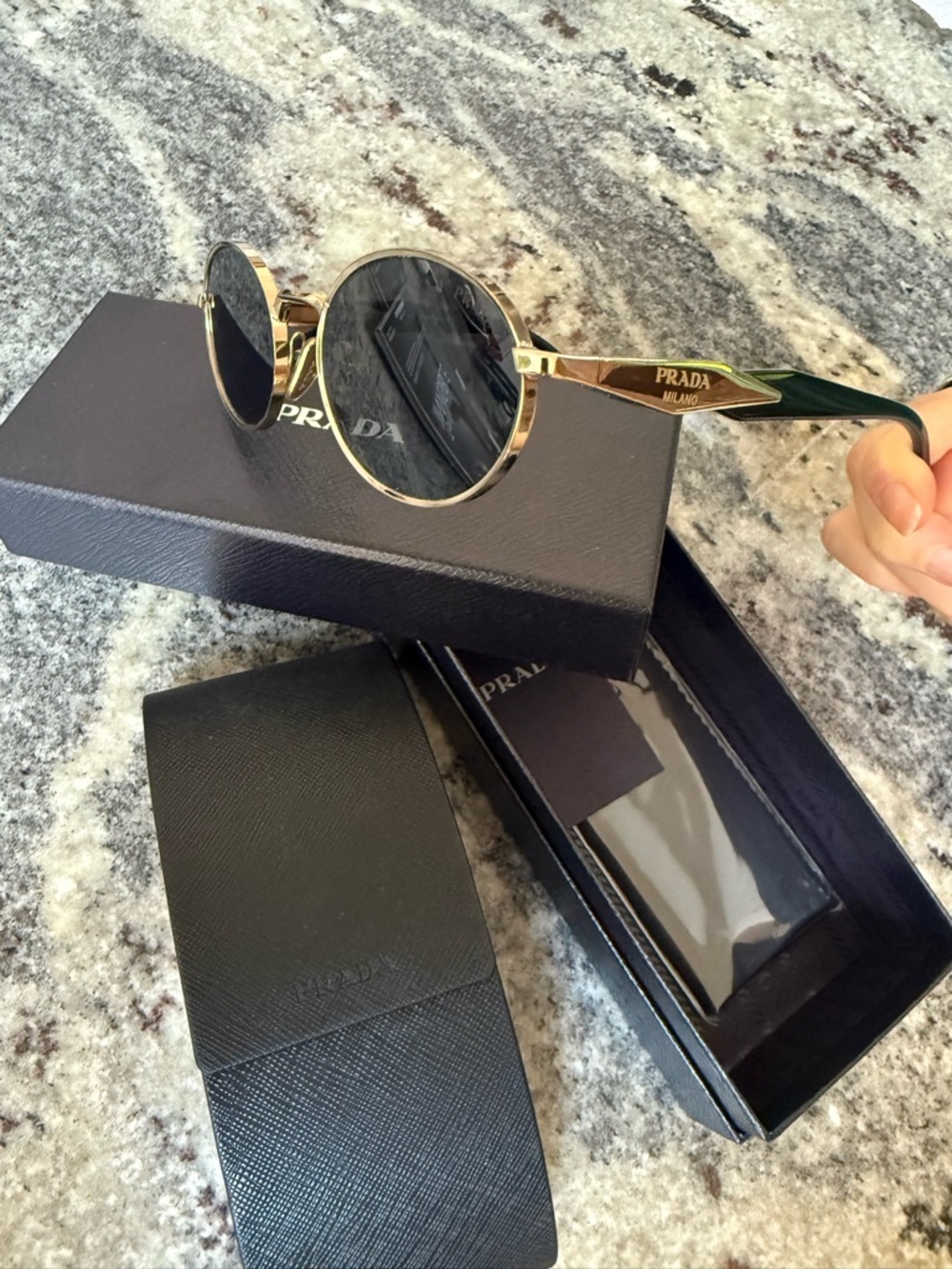 Prada Oval Gold Frame Sunglasses with Black Lenses